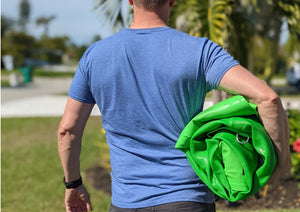 Man carrying Sunchill lake floaty